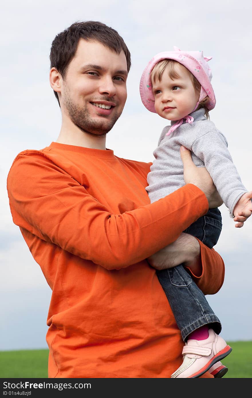 Portrait of a little girl with father outdoors. Portrait of a little girl with father outdoors