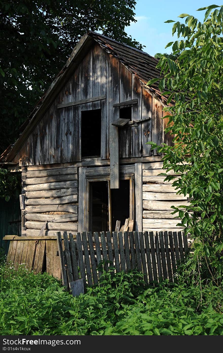 Old hut in country landscape