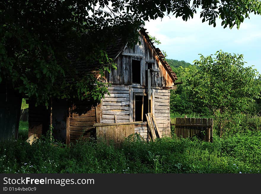 Old hut in country landscape