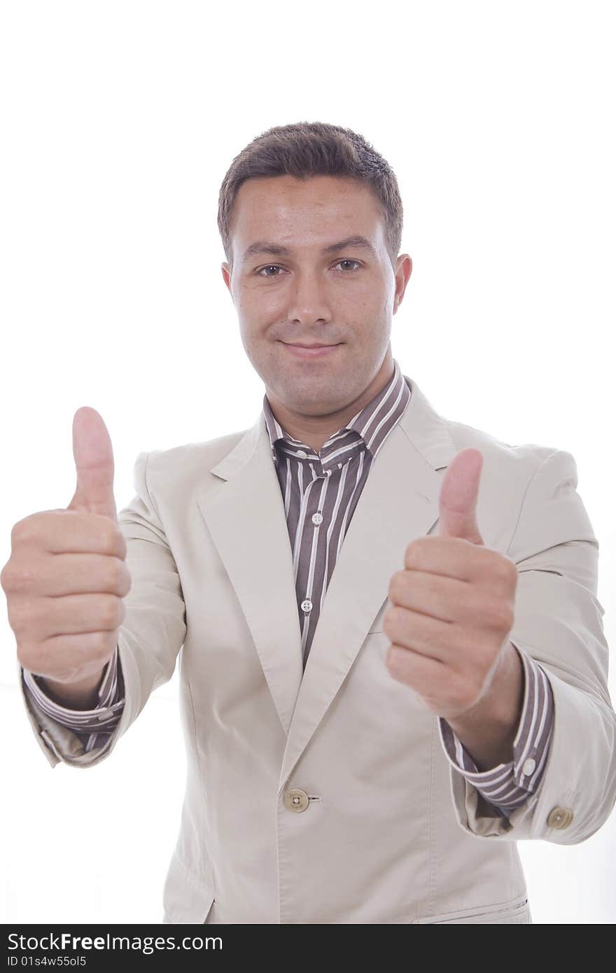 A young man his making a positive sign with his fingers. A young man his making a positive sign with his fingers