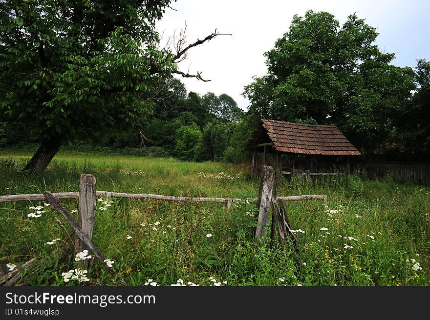 Old hut in country landscape