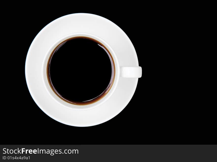 Coffee cup and saucer on a black background