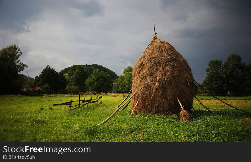 Hay piles in a country landscape