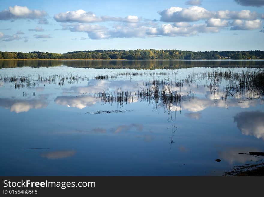 White clouds reflected in a lake