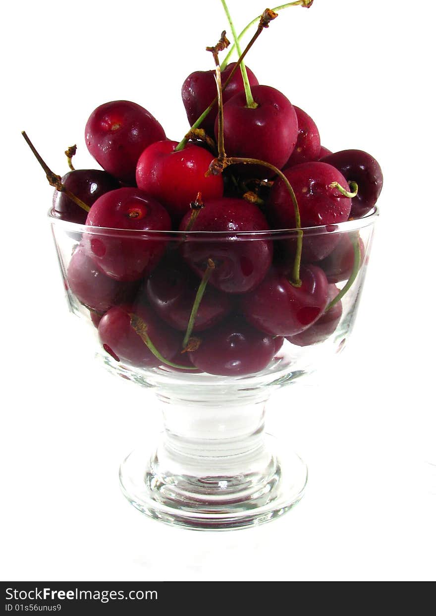 A bowl of fresh cherries on a white background. A bowl of fresh cherries on a white background