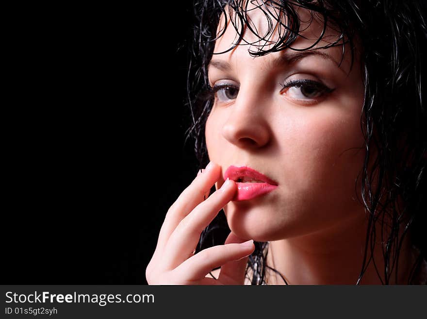 Portrait of the young beautiful girl on a black background. Portrait of the young beautiful girl on a black background