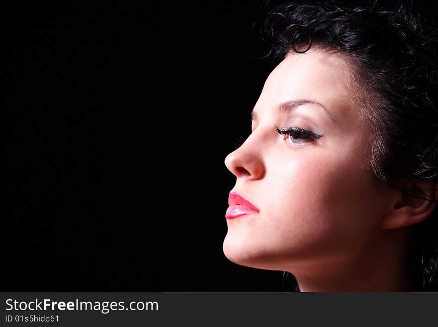 Portrait of the young beautiful girl on a black background. Portrait of the young beautiful girl on a black background