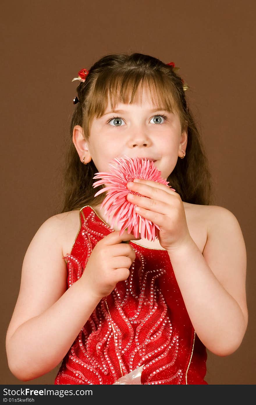 An image of a beautiful girl with pink flower. An image of a beautiful girl with pink flower