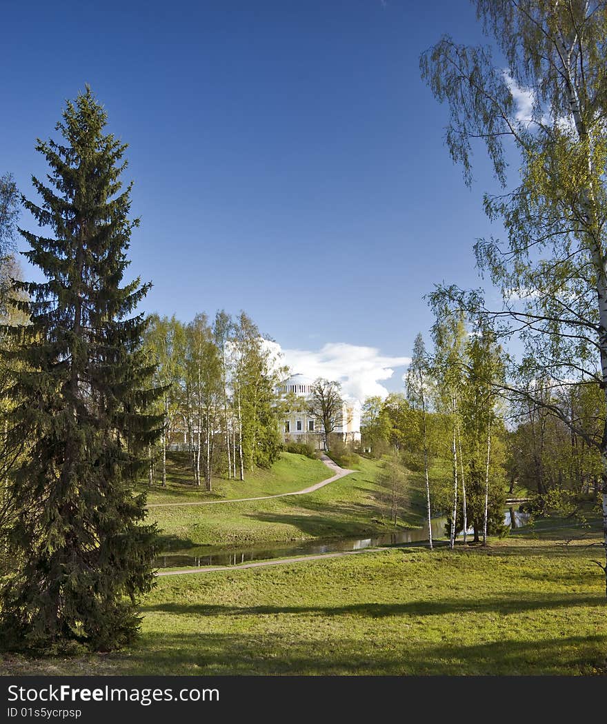 Spring park with classical building behind