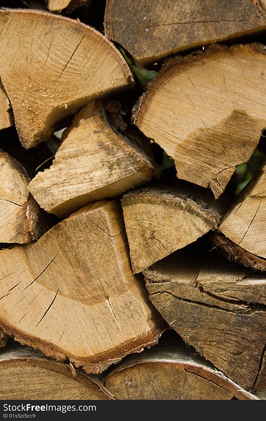 Pile of wooden logs after being cut