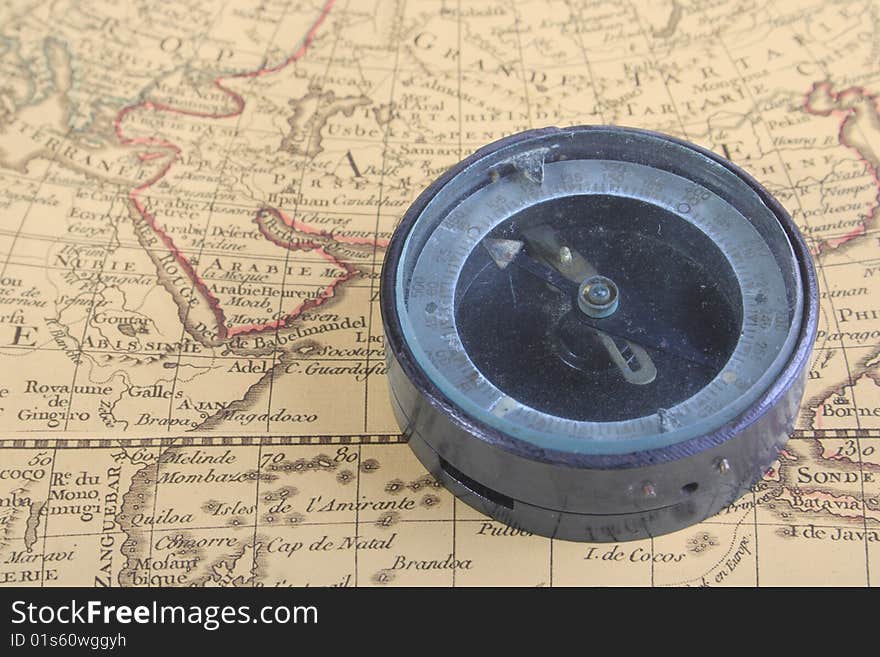 Ancient compass on ancient and very old map. Compass is over India ocean. Ancient compass on ancient and very old map. Compass is over India ocean.