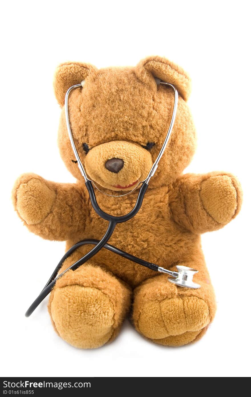 Brown teddybear acting as a doctor with a stetoscope isolated on white