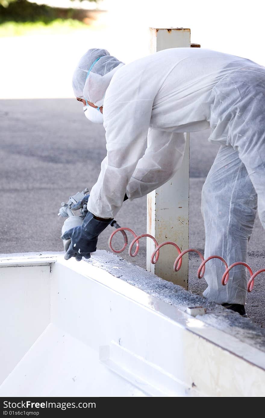 A painter at work in his construction site