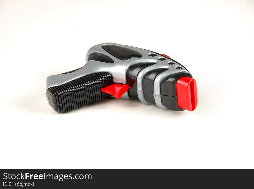 A mini toy gun isolated on a white background