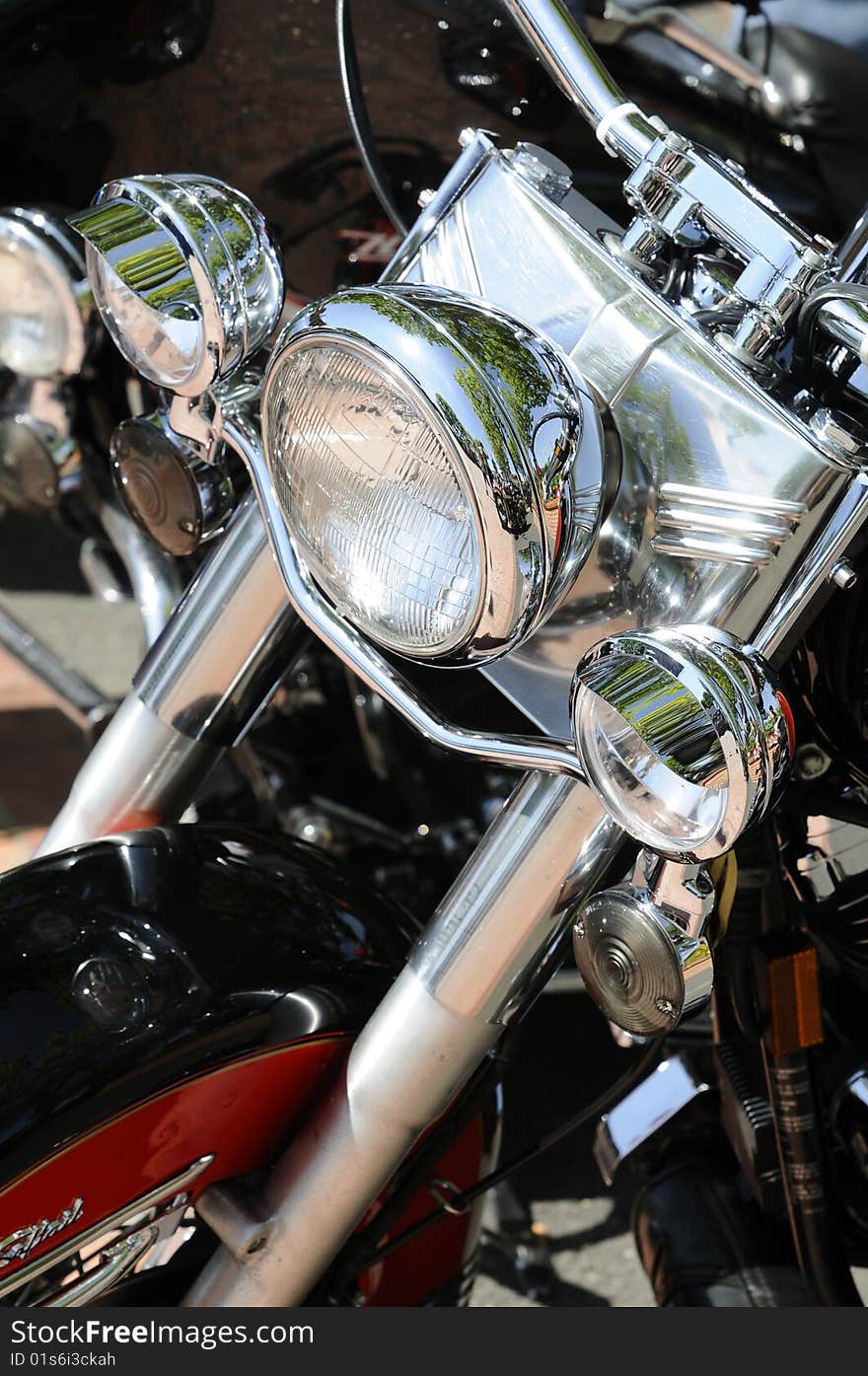 A row of motorcycle headlights