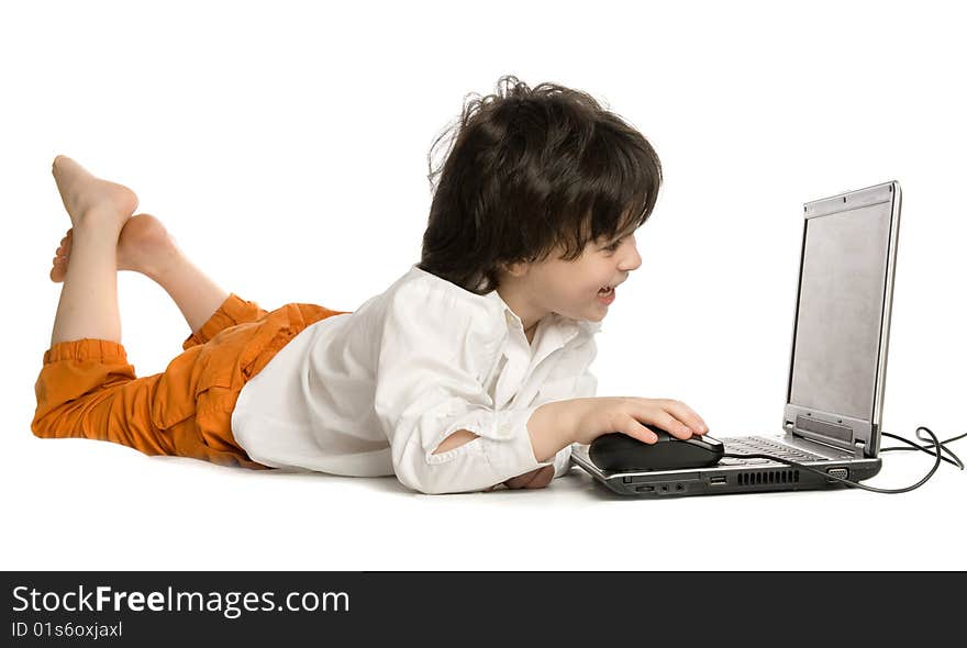 The merry boy with laptop on white background