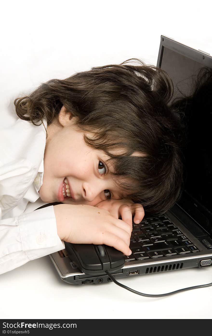 The merry boy with laptop on white background