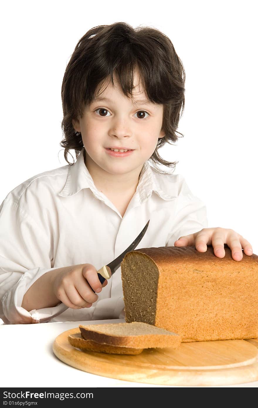 The Liitle Boy Wich Slicing A Bread On Desk