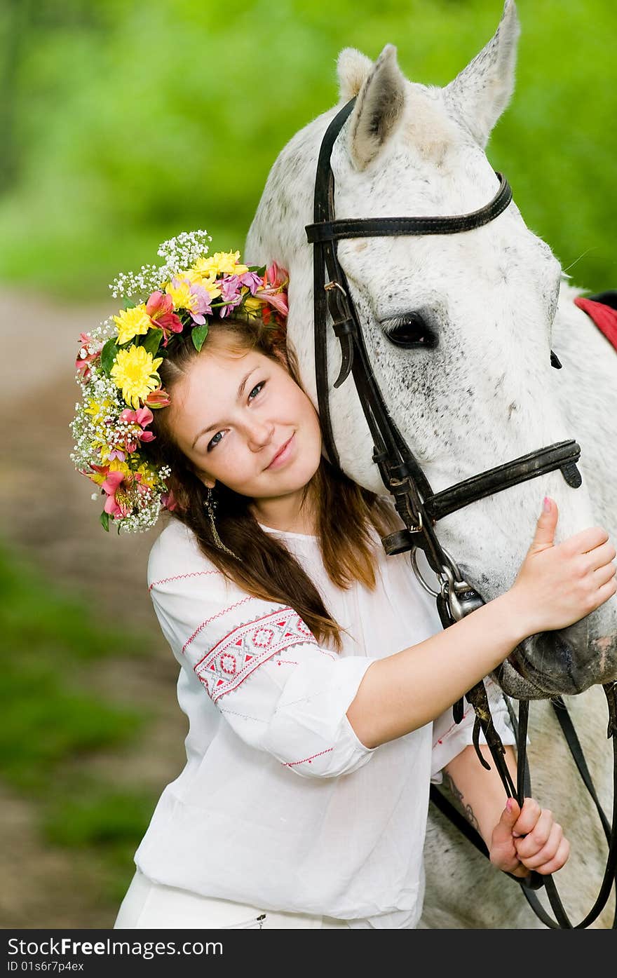 Beautiful girl in floral wreath