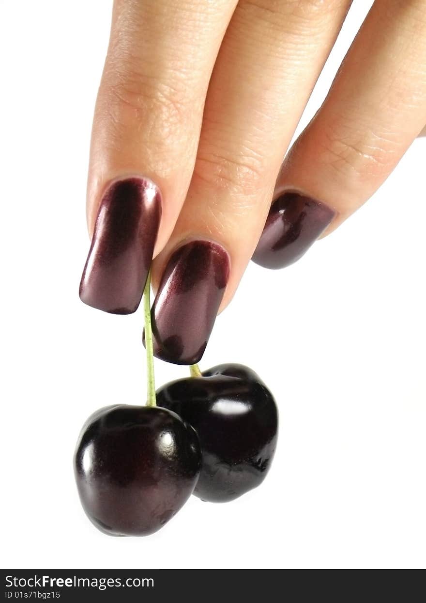 Fresh red cherry in human hand