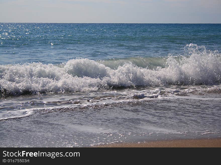 Sea beach, waves and sky