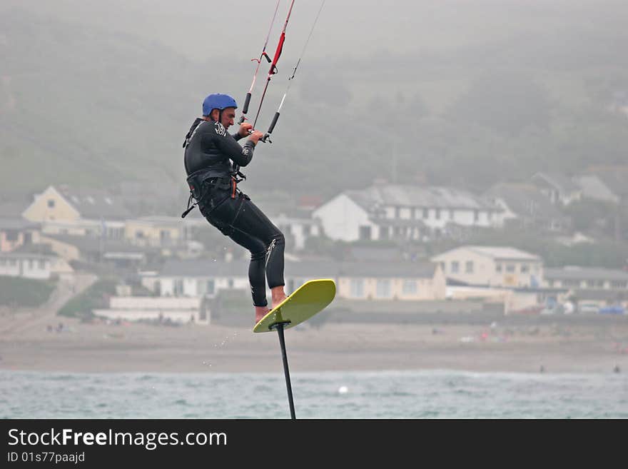 Kitesurfer surfing on hydrofoil board