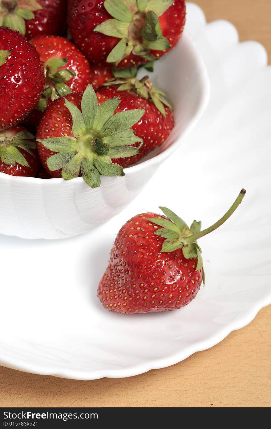 Summer Still Life with red strawberries on a white plate. Summer Still Life with red strawberries on a white plate.