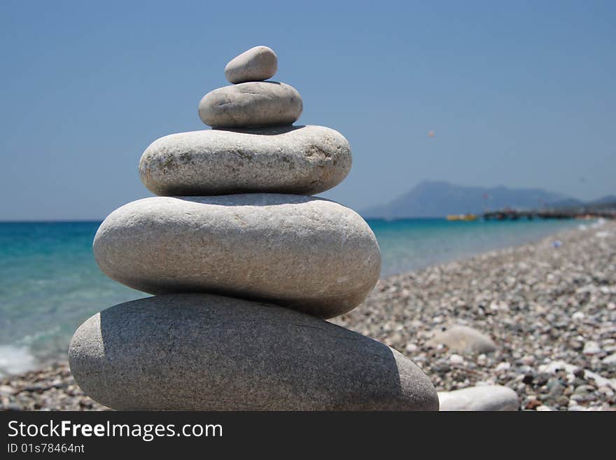 Stones on the seashore, pyramid on the beach