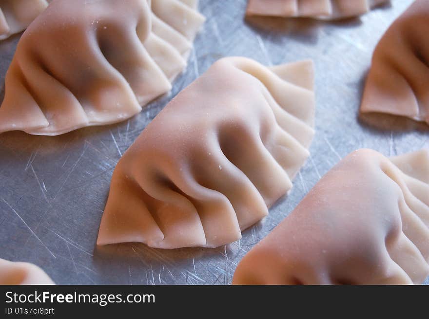 Preparing chinese pork and chive dumplings. Preparing chinese pork and chive dumplings