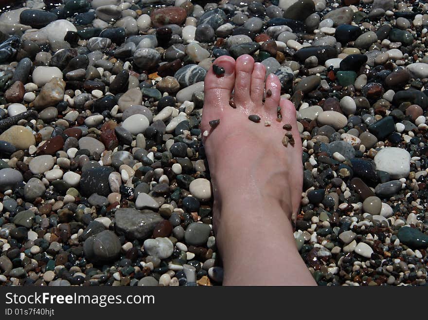 Stone therapy, foot relaxing on stones