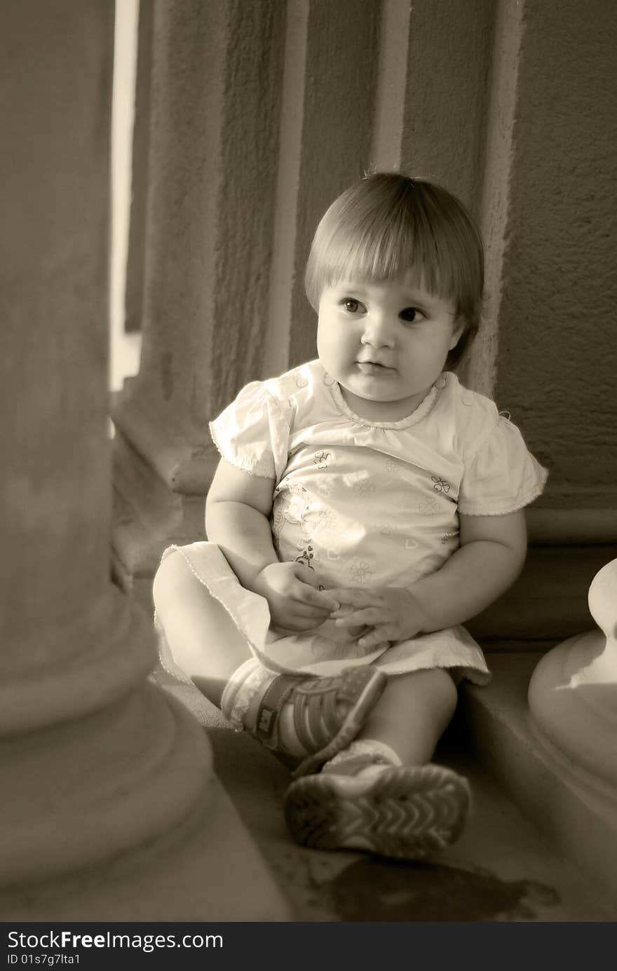 A portrait with happy little girl playing