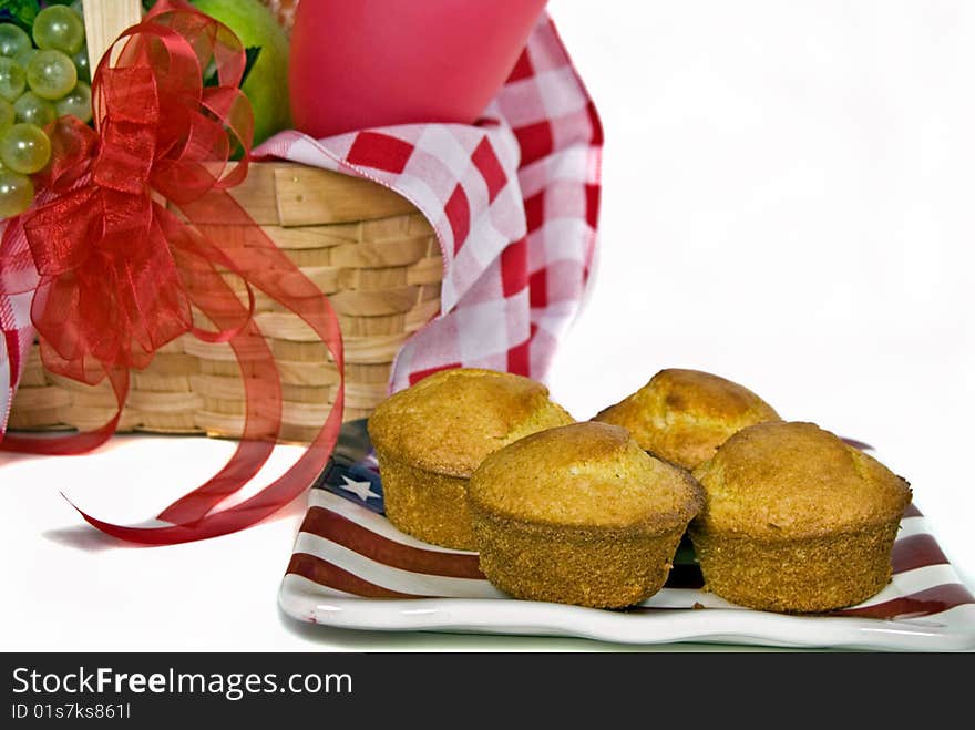 Corn muffins on a flag plate with picnic basket. Corn muffins on a flag plate with picnic basket.