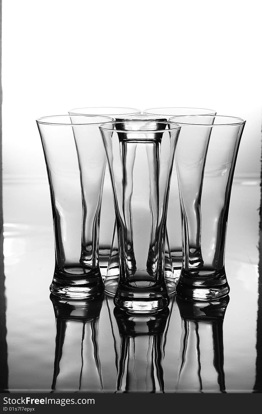 A set group of glasses with one inverted