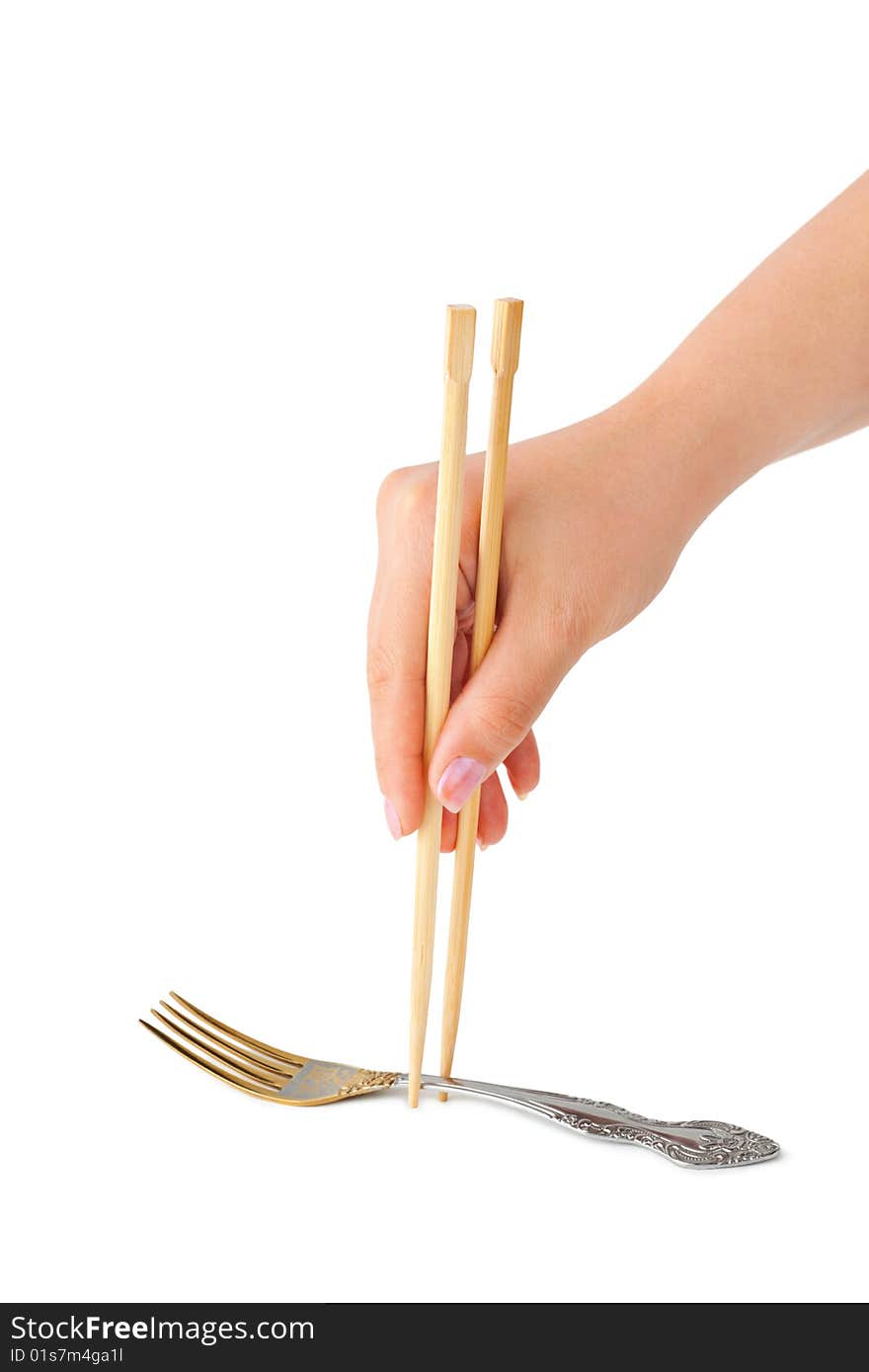 Hand with chopsticks and fork isolated on white background