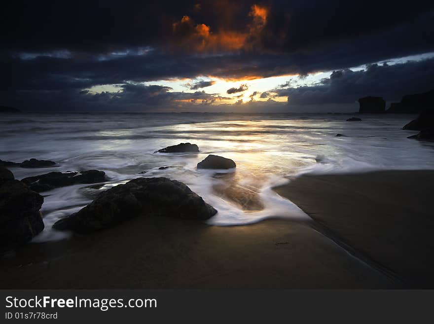 Soft flowing surf at sunset. Soft flowing surf at sunset.