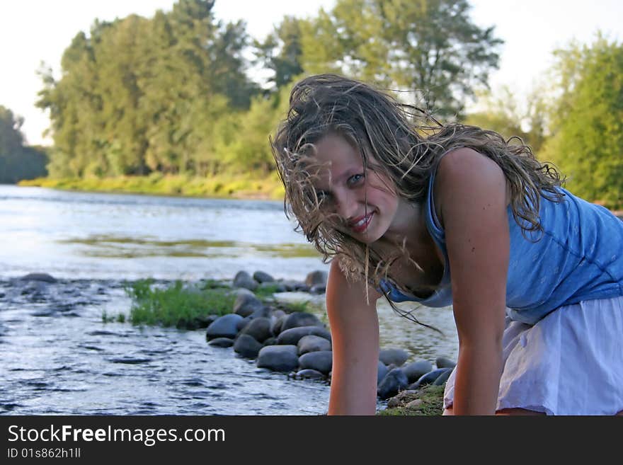 Beautiful young girl with long, brown hair in the river. Beautiful young girl with long, brown hair in the river