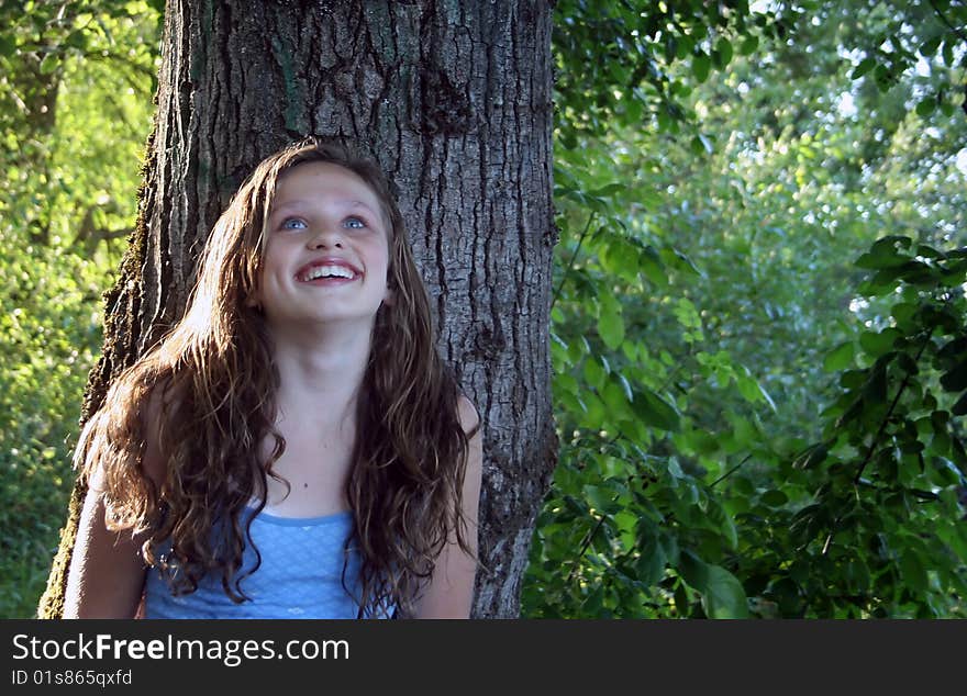 Beautiful young girl with long, brown hair on a summer evening. Beautiful young girl with long, brown hair on a summer evening