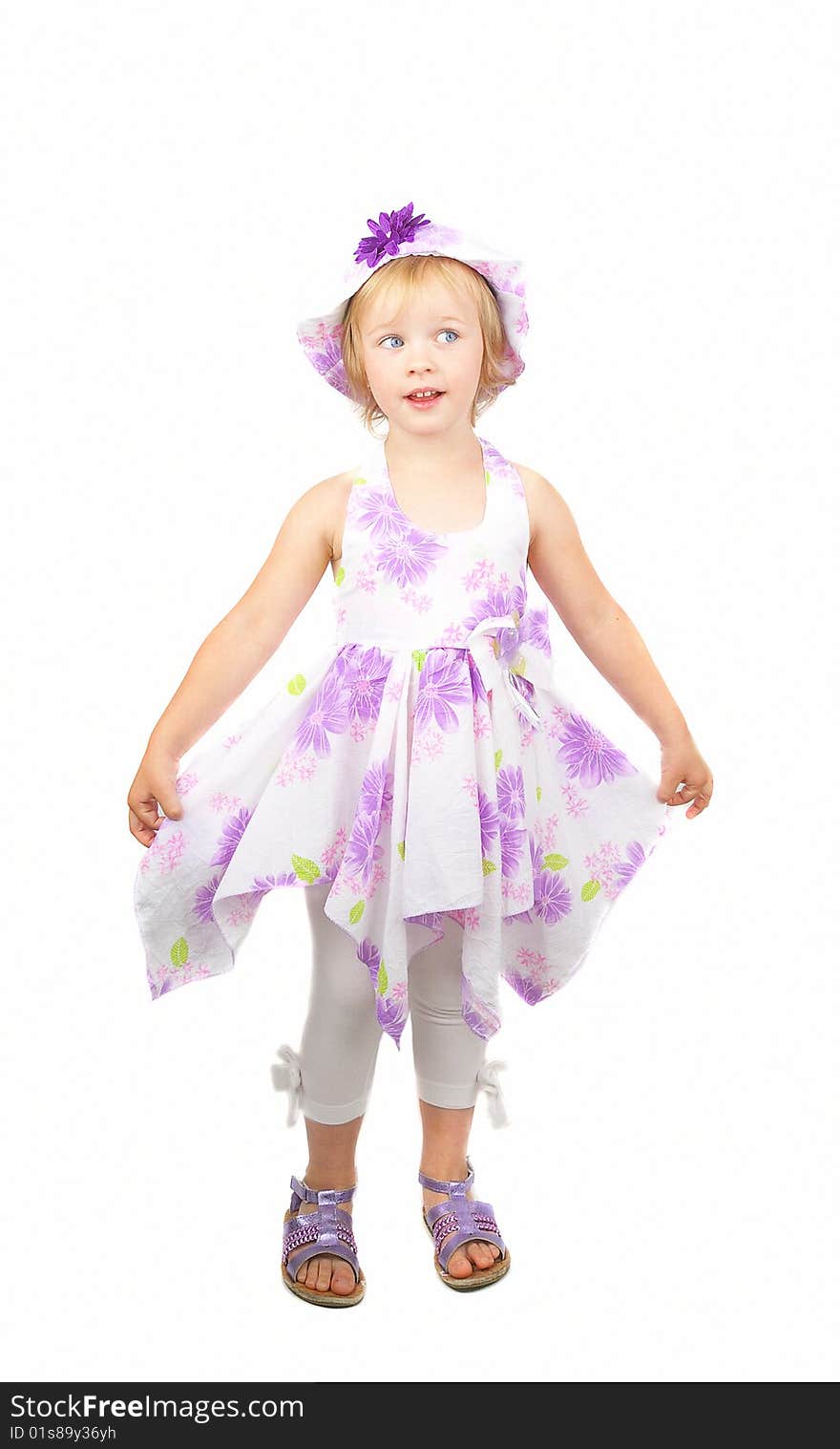 Caucasian cute little girl wearing a purple summer dress and heat dancing, isolated on white background. Caucasian cute little girl wearing a purple summer dress and heat dancing, isolated on white background.