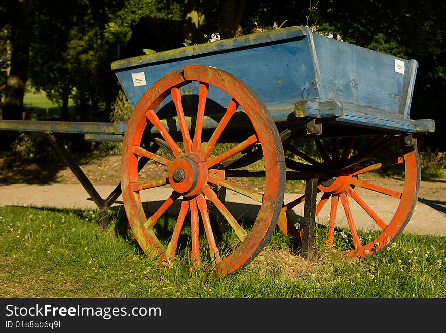 Old horse cart resting in a field.