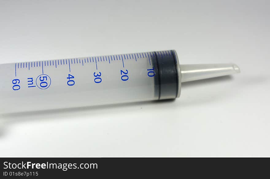 A big syringe with plain background