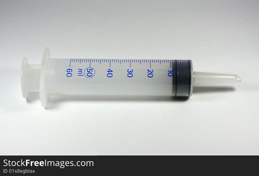 A big syringe with plain background