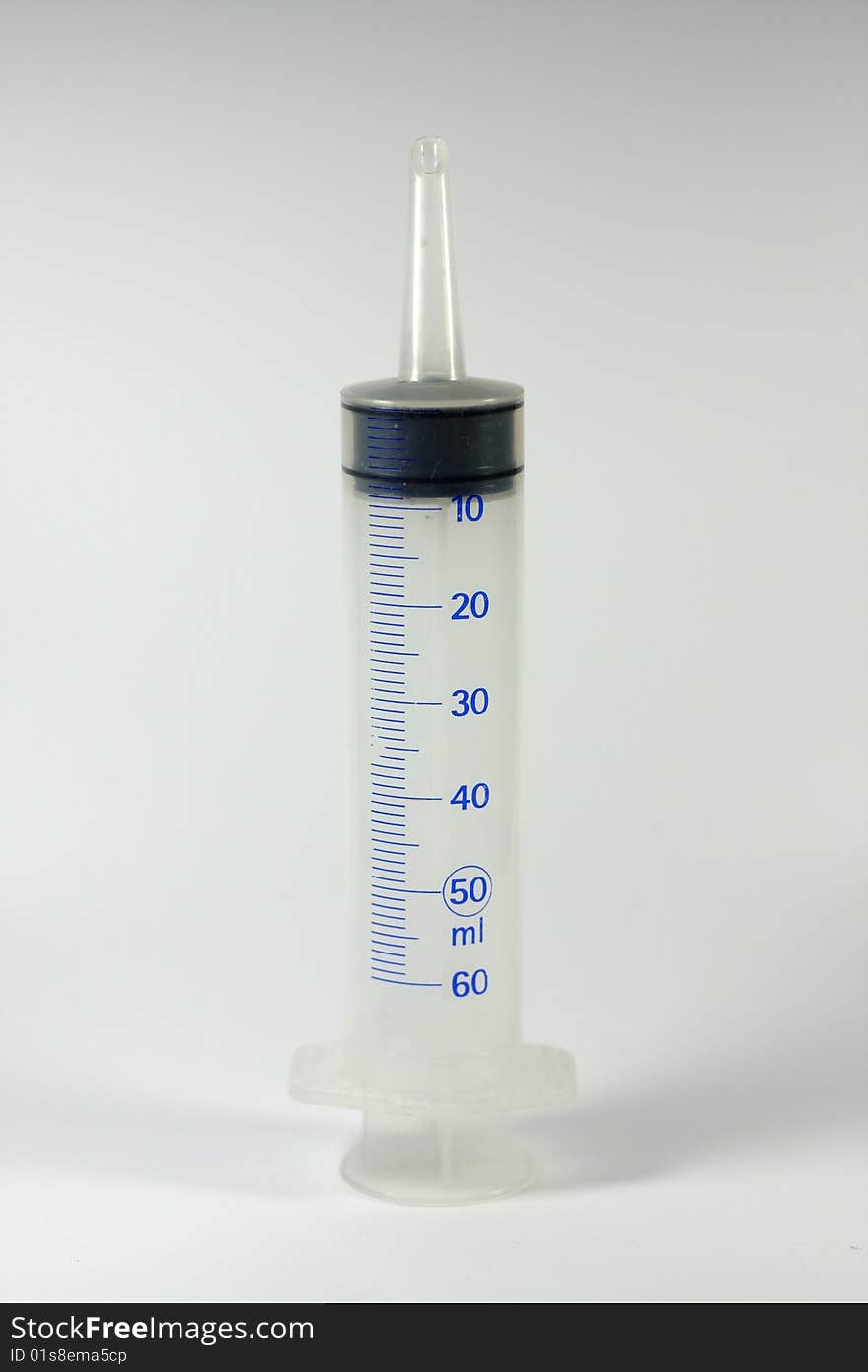 A big syringe with plain background