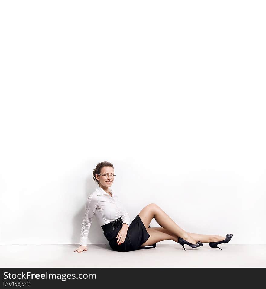 Businesswoman under an empty white board