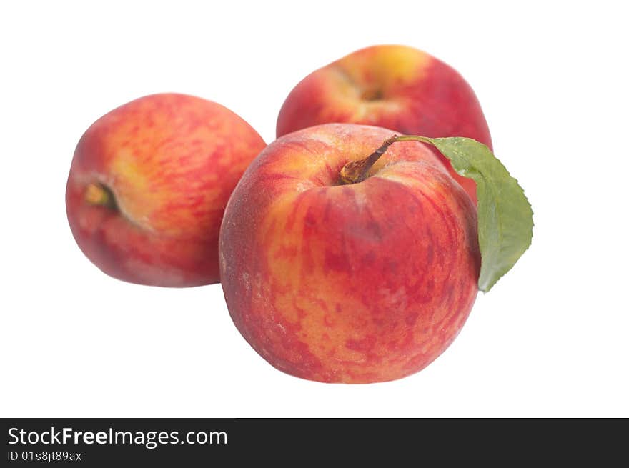 Isolated Three riped peaches