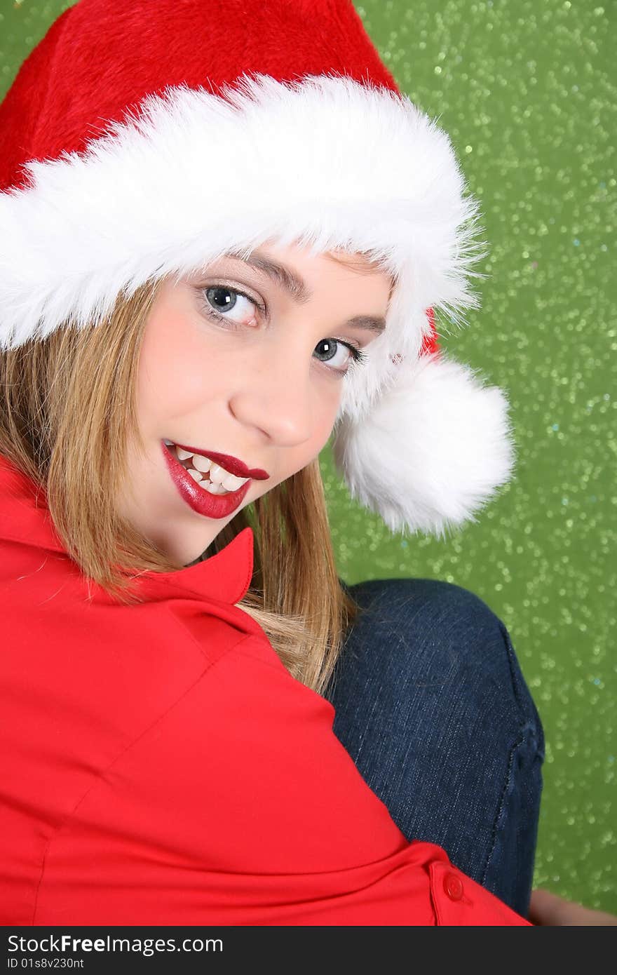 Teenager with red lips wearing a christmas hat. Teenager with red lips wearing a christmas hat