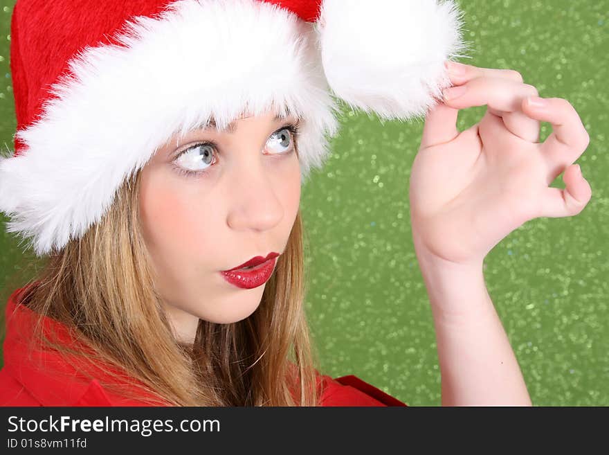 Teenager with red lips wearing a christmas hat. Teenager with red lips wearing a christmas hat