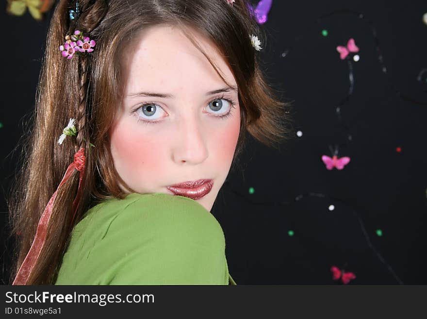 Teenage model with flowers and butterflies in her hair. Teenage model with flowers and butterflies in her hair