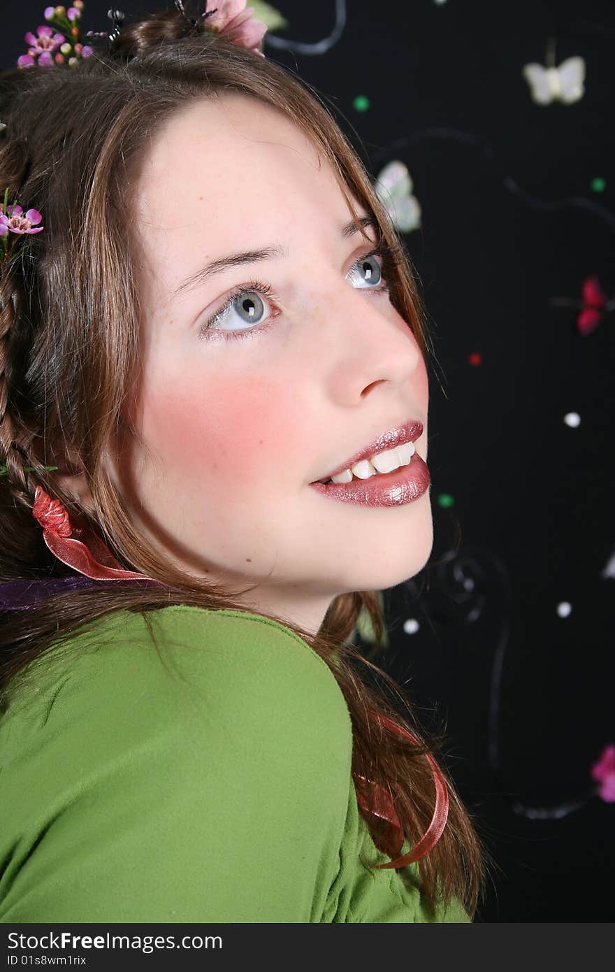 Teenage model with flowers and butterflies in her hair. Teenage model with flowers and butterflies in her hair