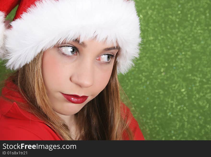 Teenager with red lips wearing a christmas hat. Teenager with red lips wearing a christmas hat