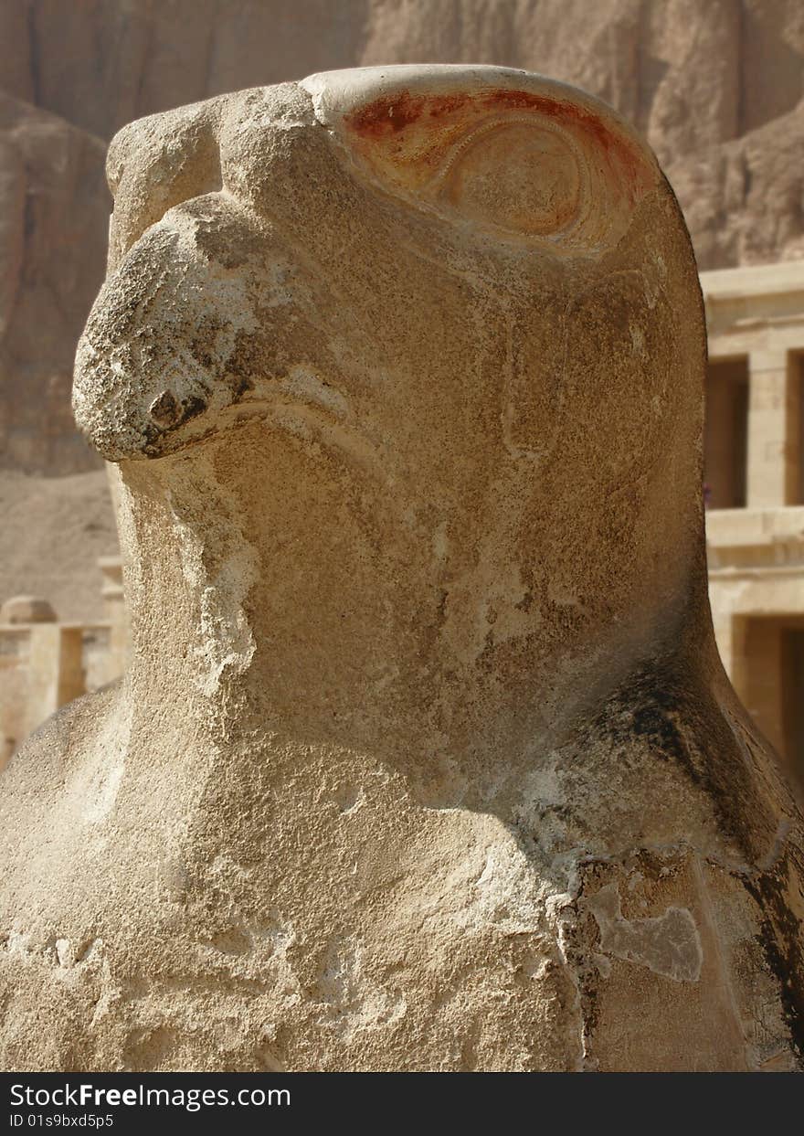 Stone statue of Horus at entrance to temple complex